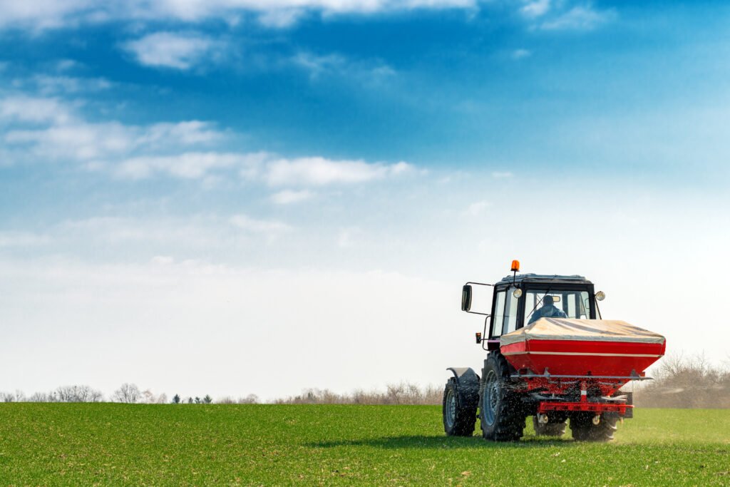 Products agricultural tractor fertilizing wheat crop field with npk